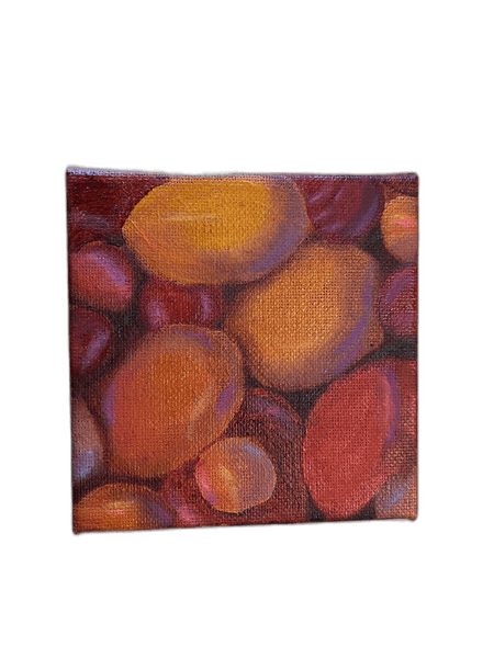 Square canvas with stones in orange and crimson